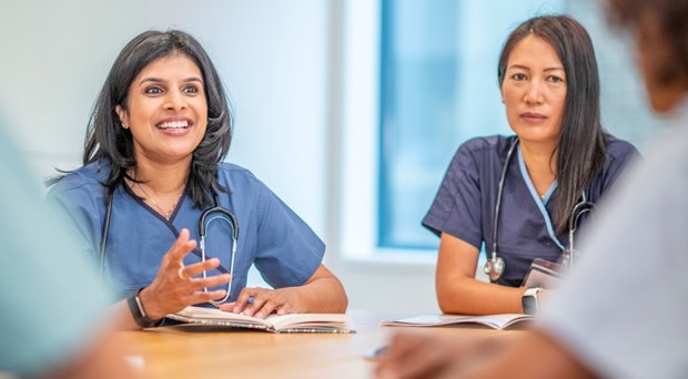 Two healthcare workers in a meeting